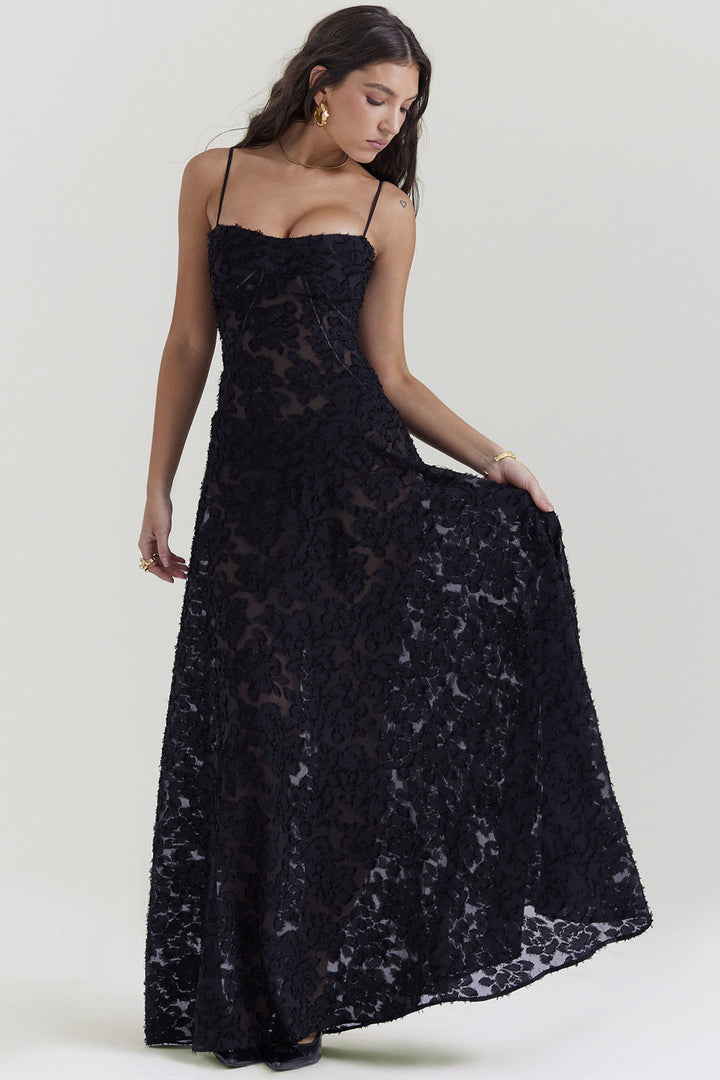 Black flowing spaghetti strap maxi dress for women. Elegant evening wear, slim fit, perfect for special events.