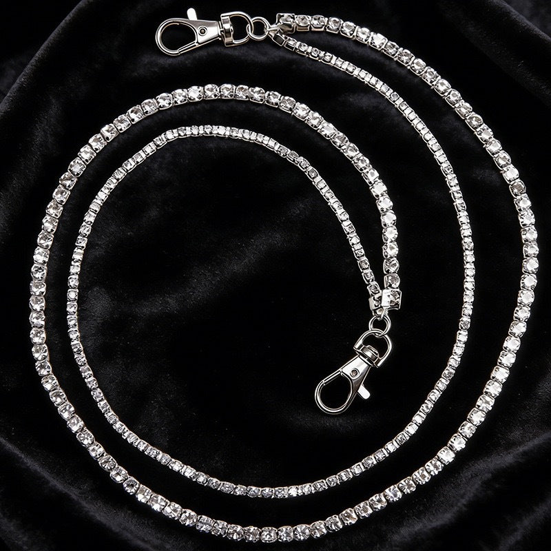 Close-up of a glamorous women's crystal rhinestone chain, an elegant and sparkling jewelry accessory.