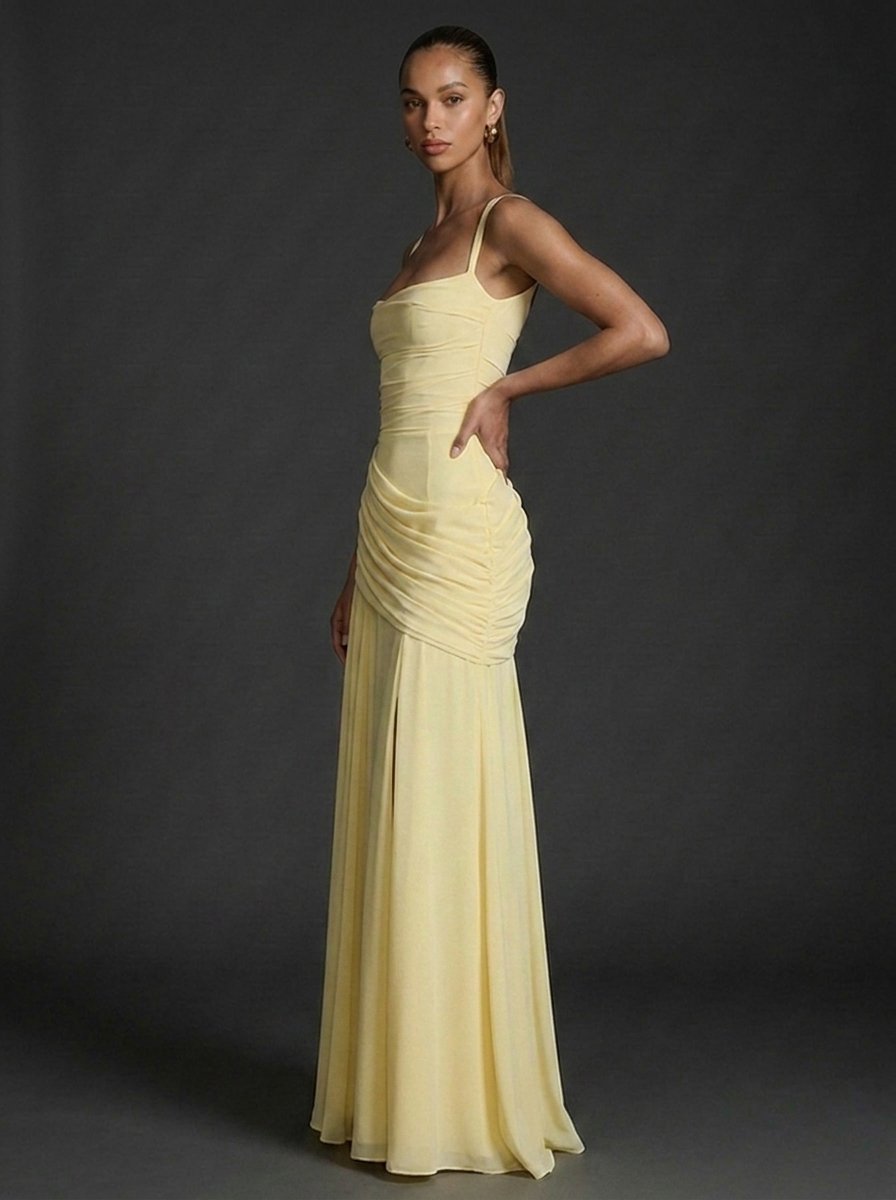 Chic sleeveless square-neck maxi dress with elegant ruching and draped fabric, suitable for summer occasions.