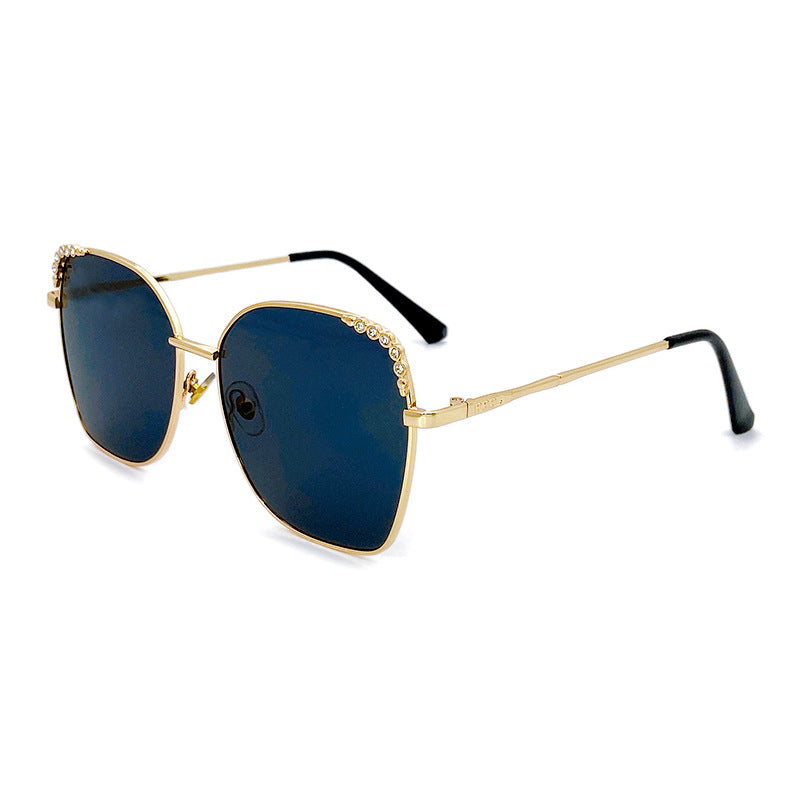 Women's elegant square sunglasses with sparkling accents. Fashionable UV protective eyewear.