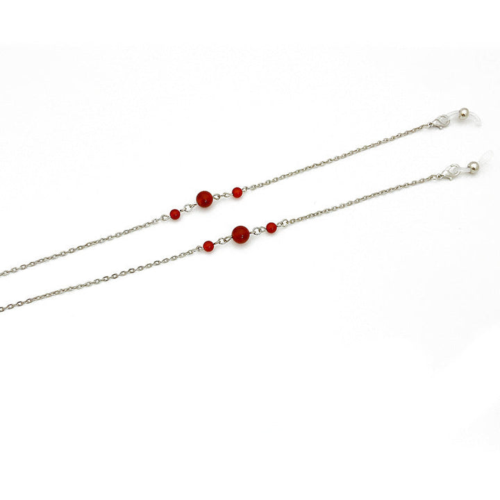 Durable stainless steel chain necklace for women, adorned with an elegant red accent. Fashionable accessory.