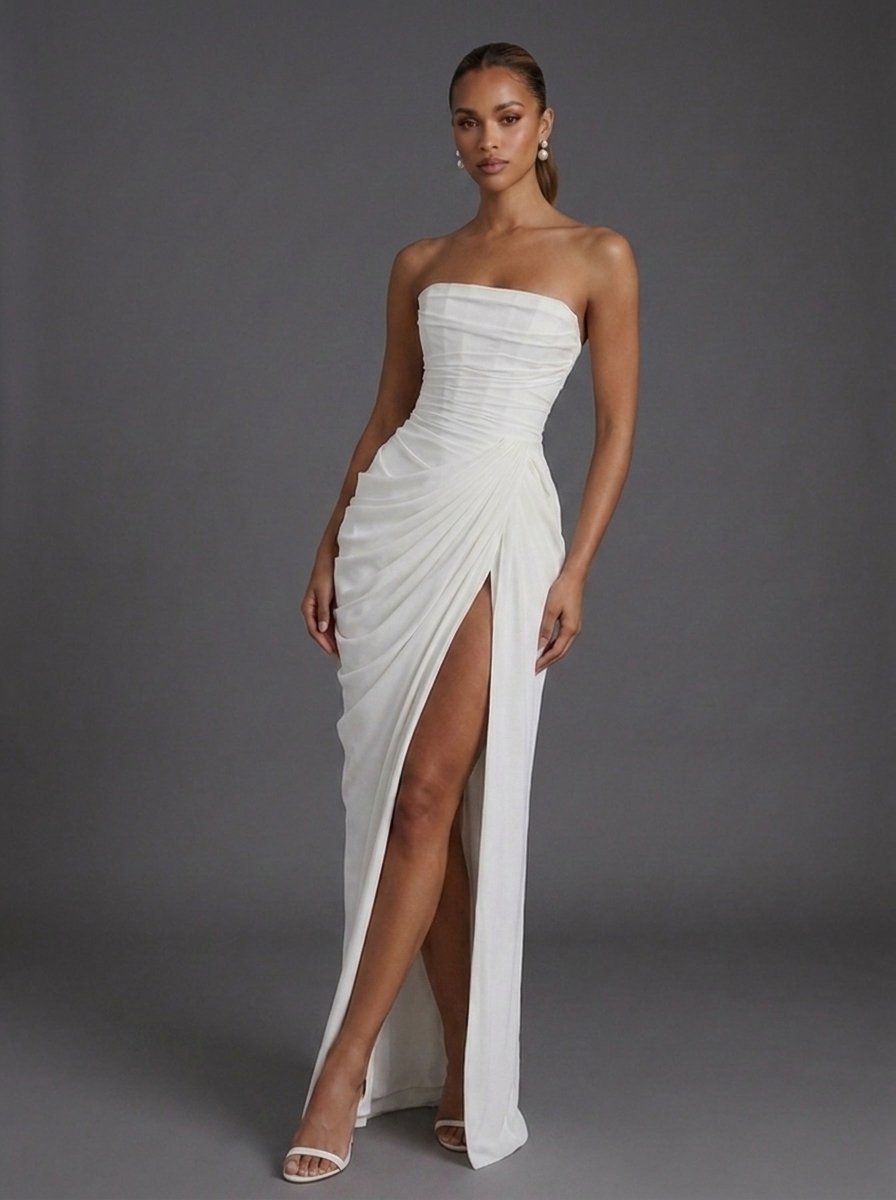 Stunning women's wedding guest maxi dress: strapless, corseted, ruched, and with a daring thigh-split.