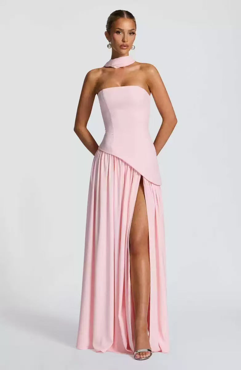 Women's occasion wear: elegant strapless maxi dress with a stylish leg slit, ensuring a stunning formal look.