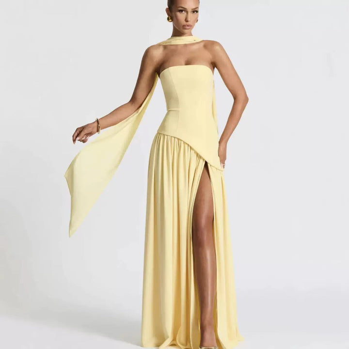 Flattering long strapless dress for women, designed with an elegant slit. Perfect as a wedding guest or evening gown.