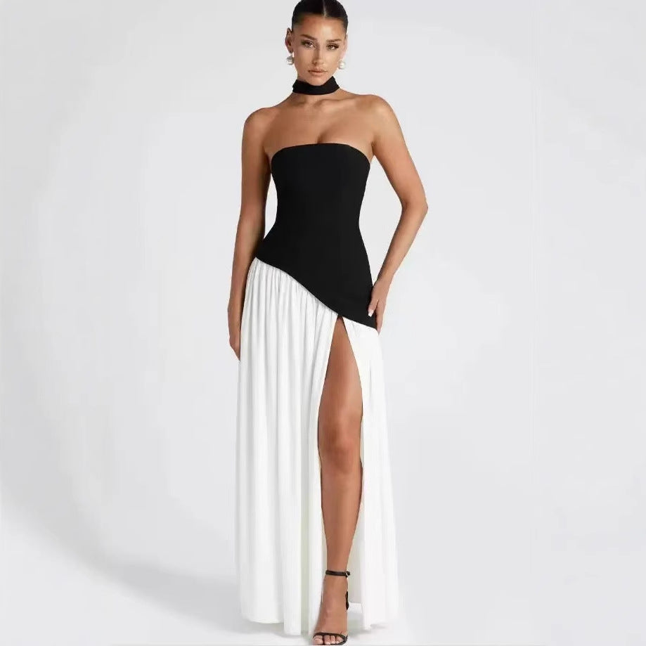Stylish strapless maxi gown for women, featuring a flattering leg slit. Ideal wedding guest or party dress.