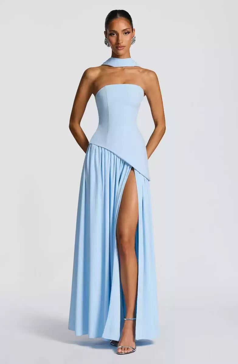 Sophisticated women's strapless wedding guest dress. Long maxi gown with a tasteful high slit for elegance.