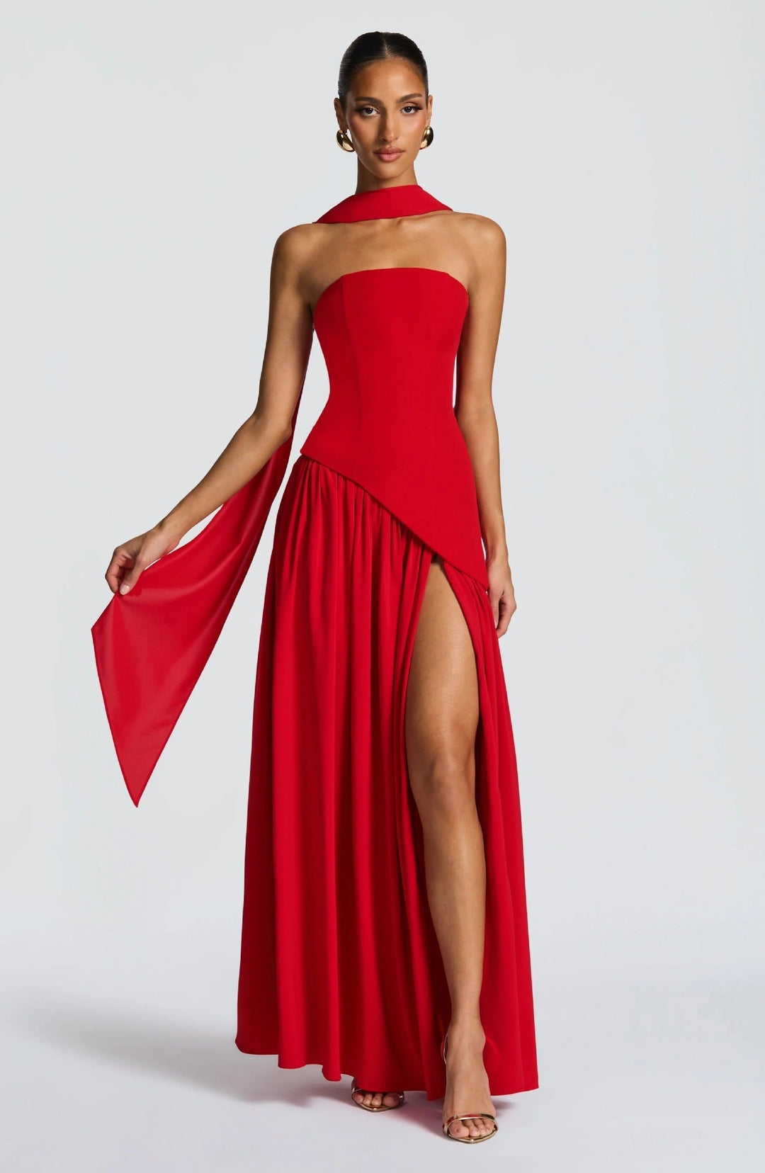 Graceful women's strapless formal dress. This long maxi gown features an alluring leg slit for evening wear.