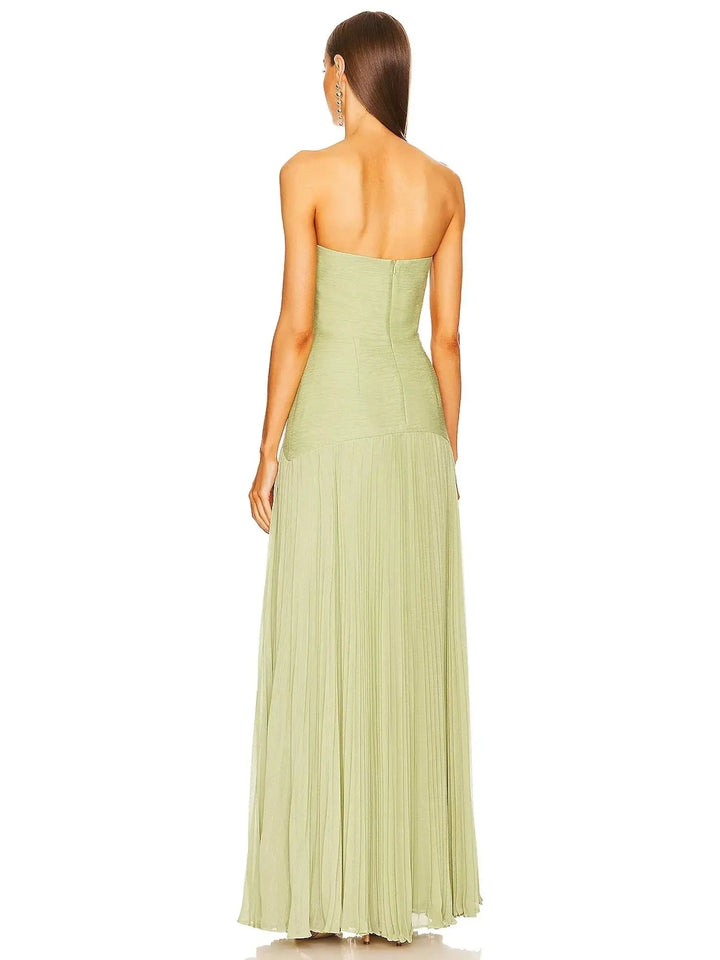 Formal women's strapless evening dress with a beautifully pleated long skirt, offering an elegant silhouette for galas.