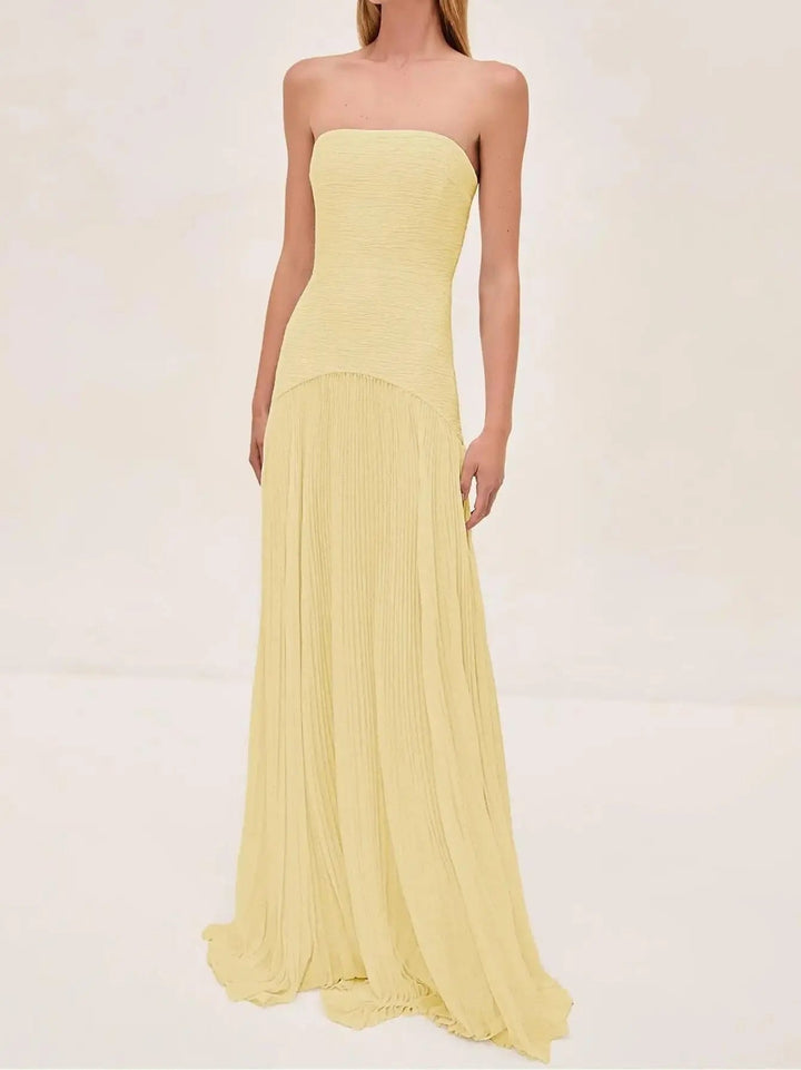 Sophisticated women's strapless formal gown with a graceful pleated maxi skirt, designed for elegant evening parties.