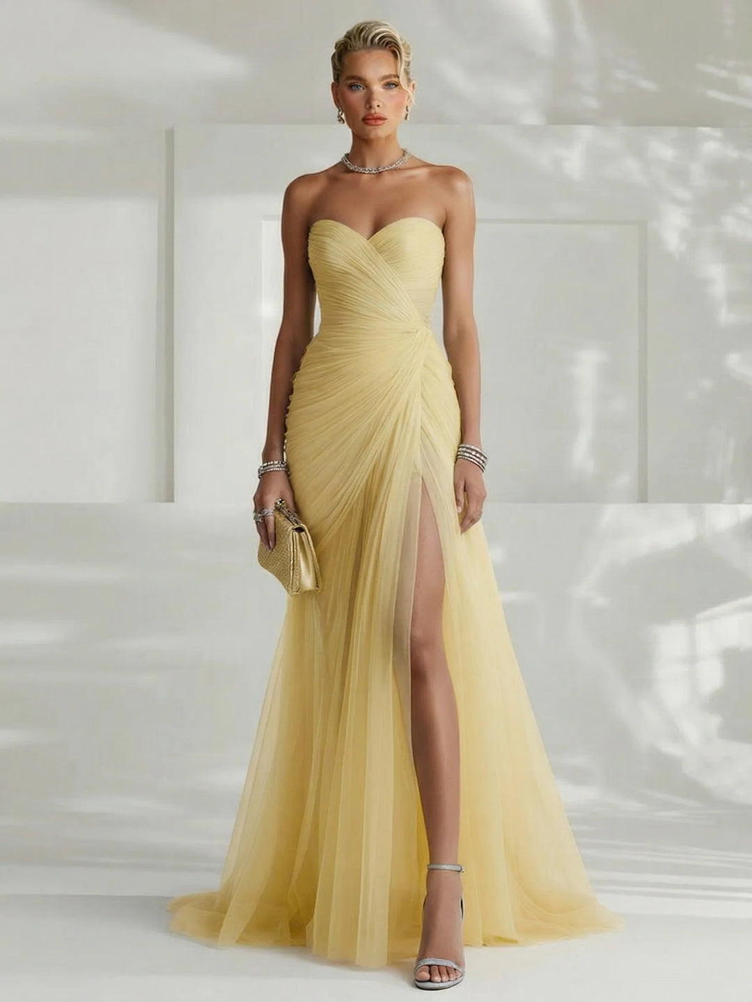 Women's elegant pleated strapless maxi dress. Flowy fabric, a stunning formal evening gown for special occasions.