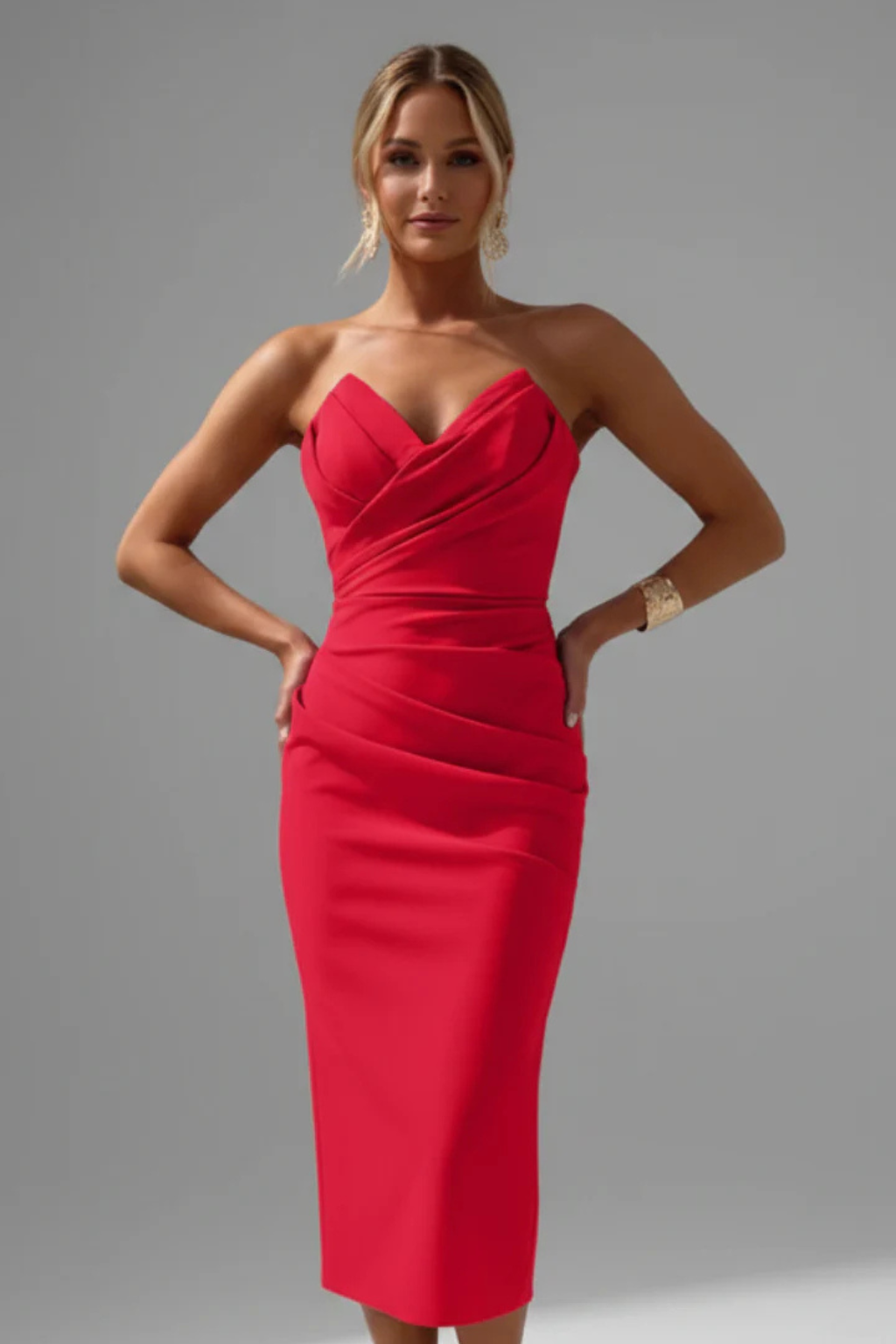 Back view of an elegant women's strapless ruched sweetheart midi dress, ideal for any occasion.