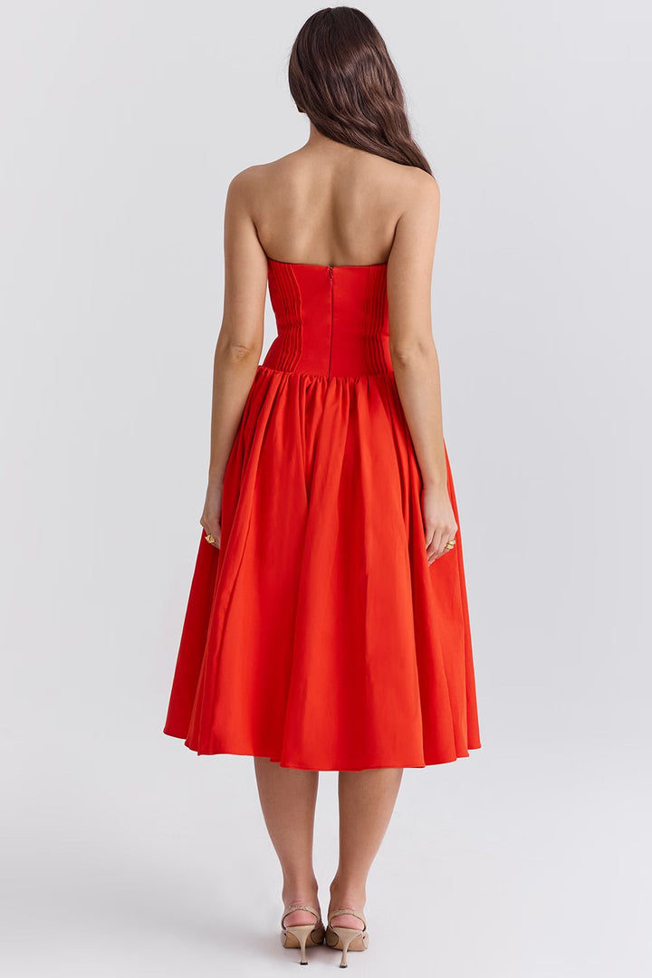 Stylish women's strapless midi dress featuring a sweetheart neckline and a gracefully flared midi skirt.