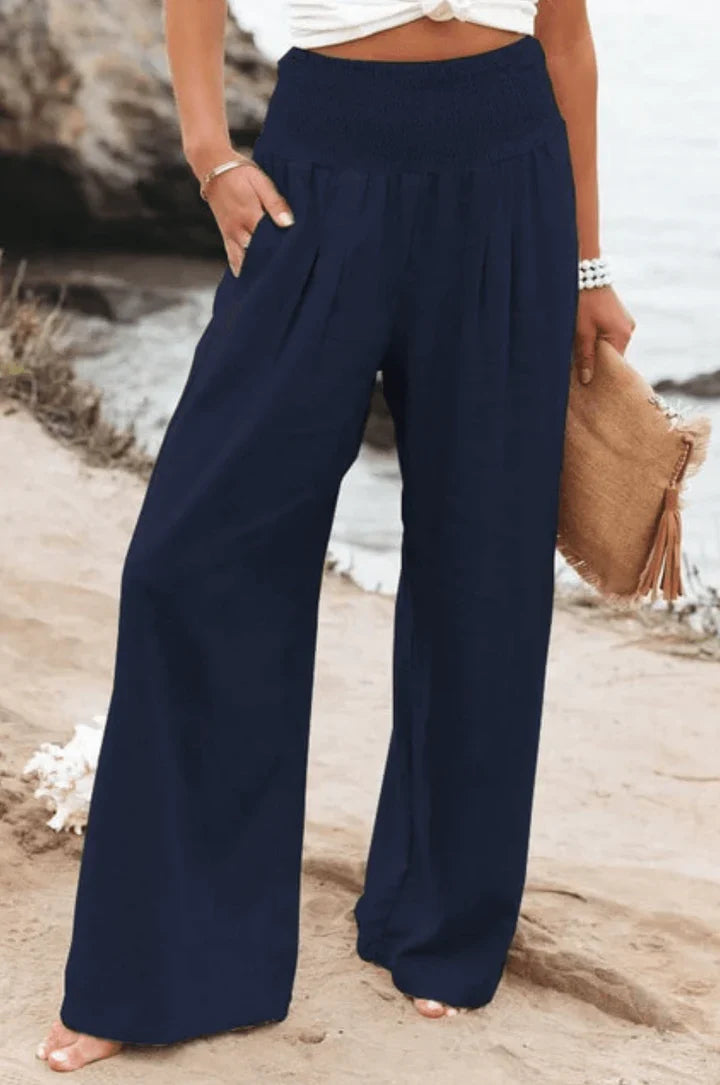 Elegant women's stretchy palazzo pants, high-waisted and wide-legged for comfort and style.