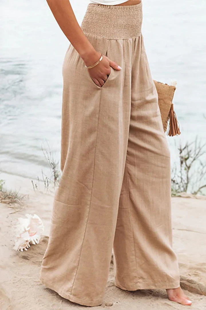 Elegant women's bottoms: stretchy palazzo pants with a high waist & wide leg, ideal for comfort & style.