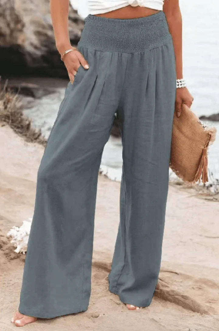 Dressy wide-leg palazzo pants for women, high-waisted and elegant, suitable for spring/summer fashion.