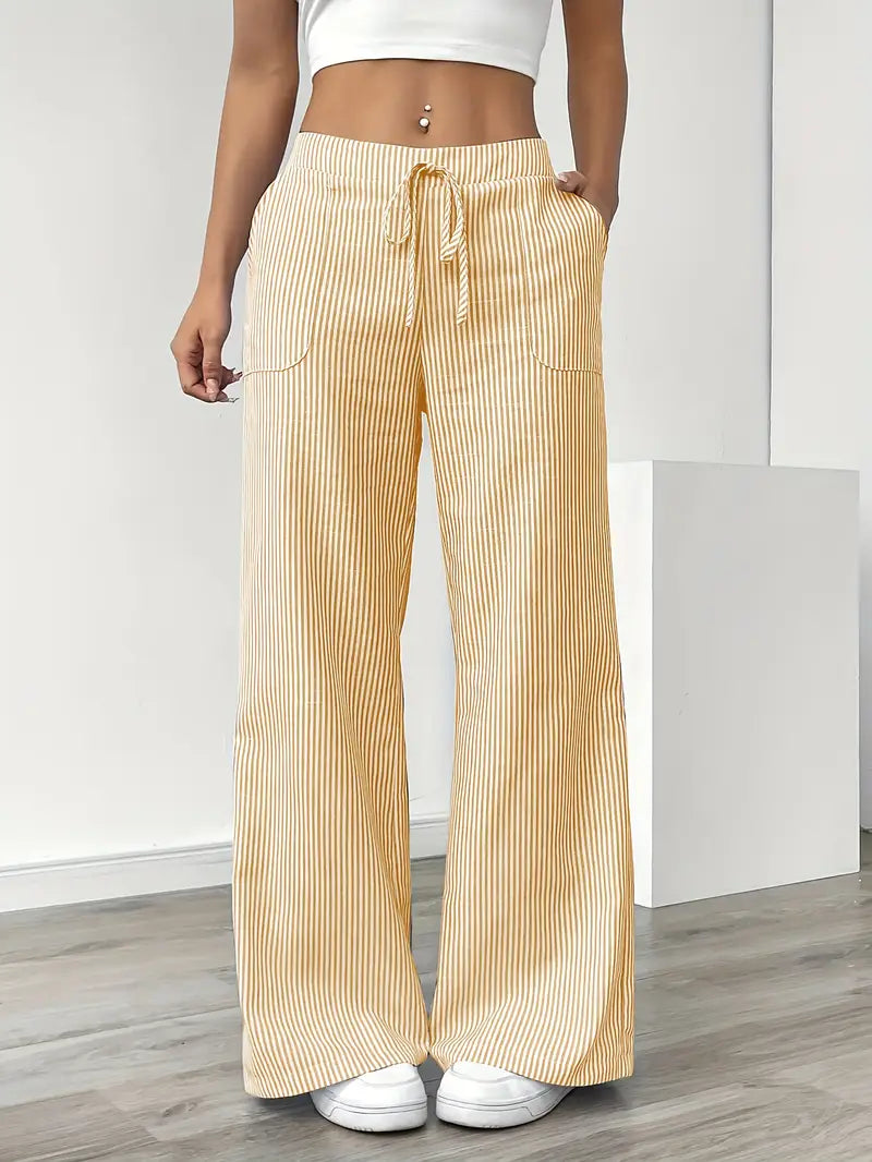 Elegant women's striped pants with pockets. Perfect for a chic spring or summer look.