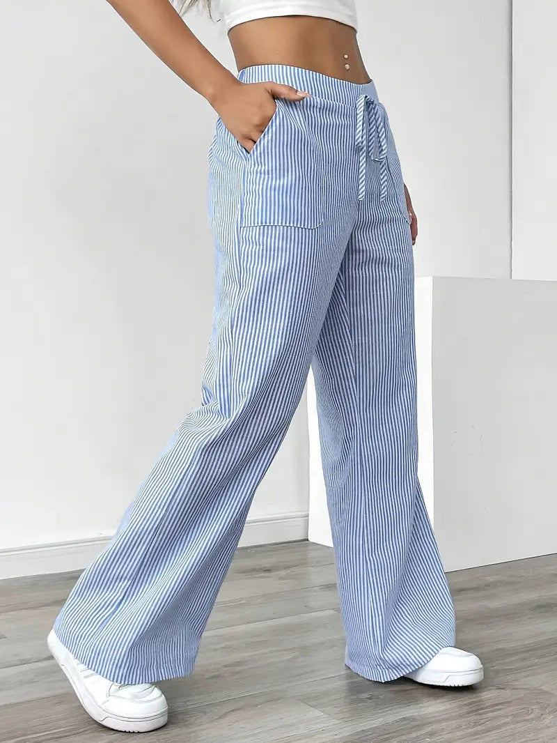 Soft fabric striped women's wide-leg pants with pockets, comfortable for casual elegance.