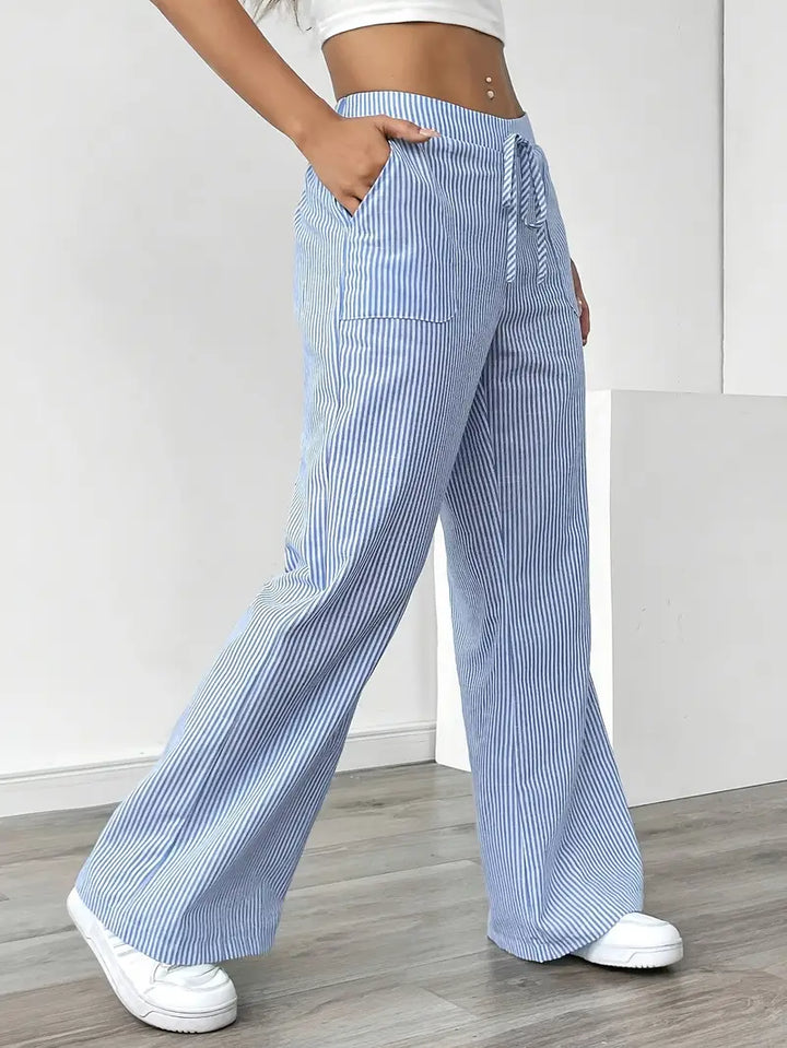 Soft fabric striped women's wide-leg pants with pockets, comfortable for casual elegance.