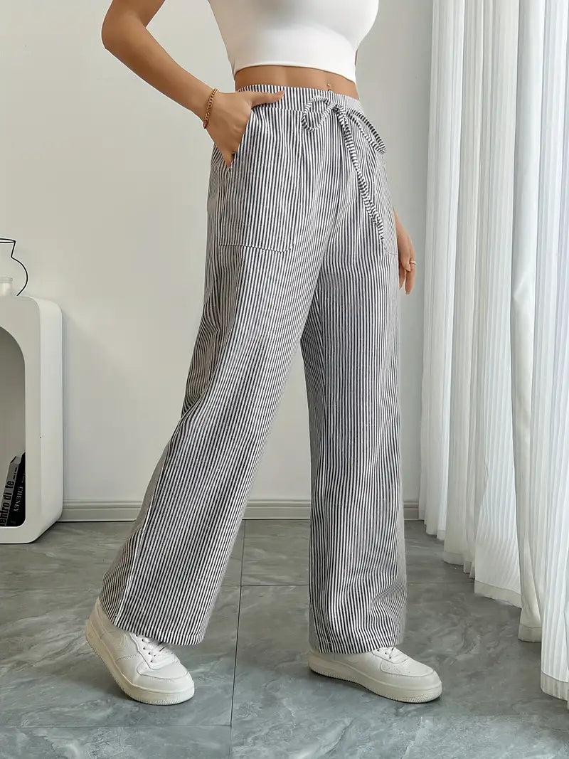 Stylish striped vacation pants for women, wide-leg and comfortable with essential pockets.