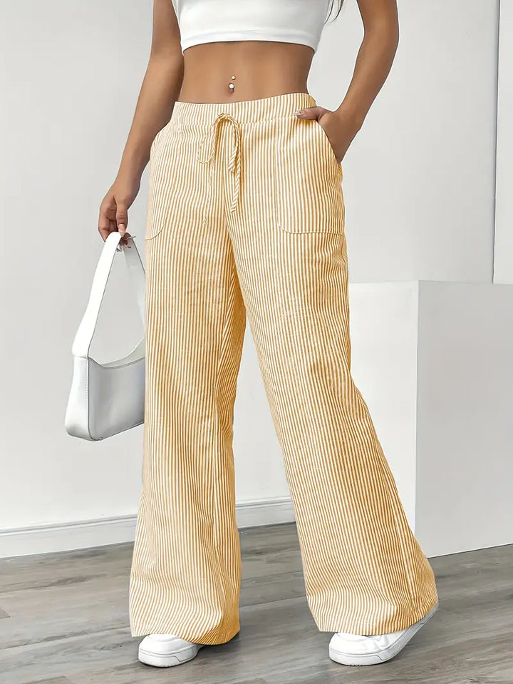 Vertical striped women's elegant trousers, high-waisted with functional pockets.