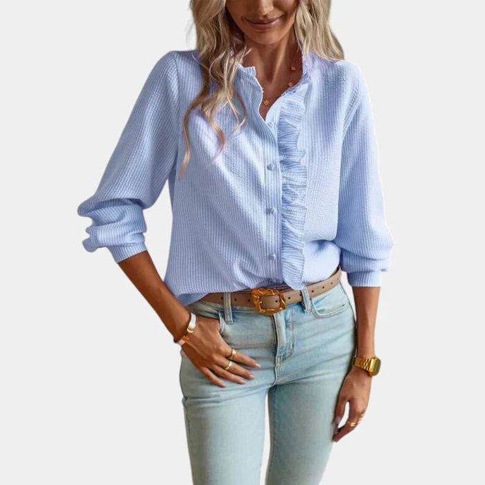 Comfortable long-sleeve striped top for women, featuring elegant ruffles and a classic button-down style.