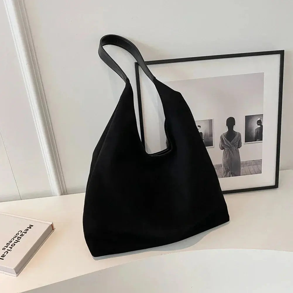 The elegant suede shoulder bag for women, styled for a modern and versatile look.