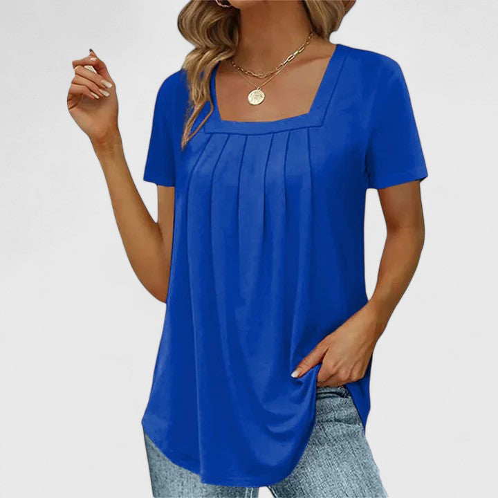 Women's square neck, short sleeve blouse. This elegant summer top offers chic style and sophisticated comfort.
