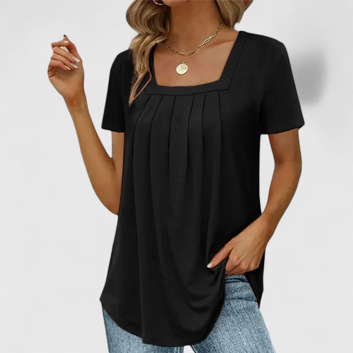 Versatile women's elegant blouse with square neck. A comfortable short-sleeve summer top for sophisticated style.