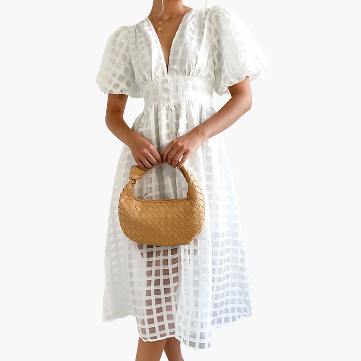 Elegant women's party midi dress, sleeveless, flowy A-line cut, sophisticated summer fashion.