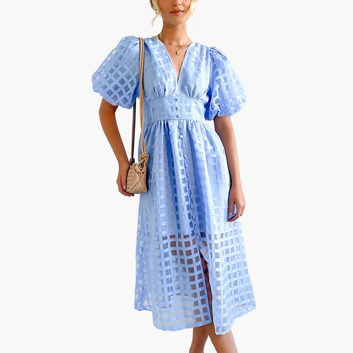 Elegant A-line midi dress for women, sleeveless and versatile for casual or party wear.
