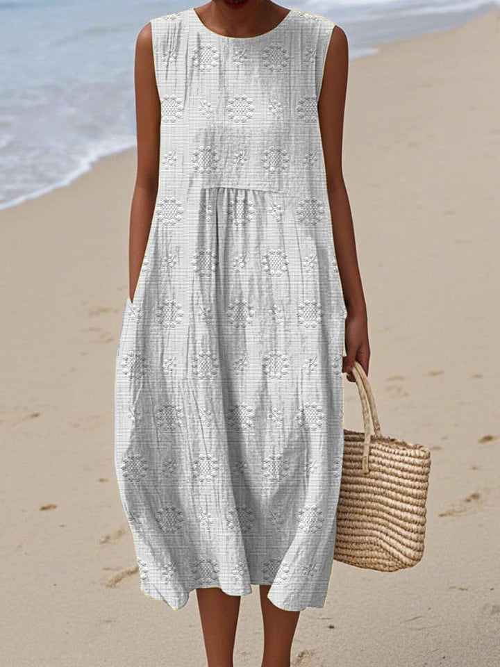 Flattering women's spring/summer midi dress with effortless style. Features an elegant design & practical pockets.