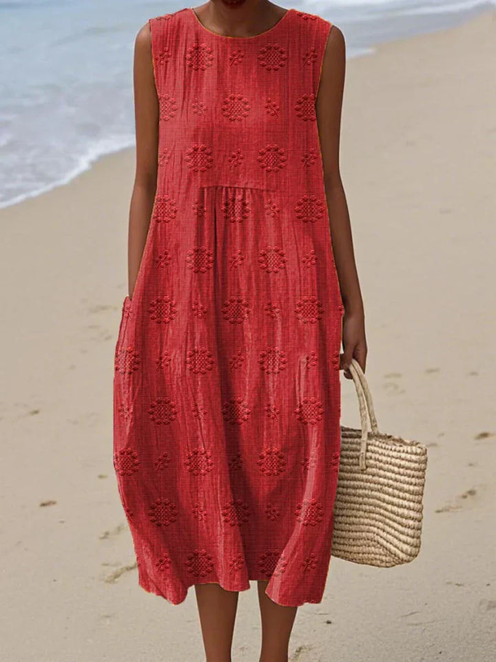 Versatile women's day dress, an elegant midi for summer or spring. Sleeveless design with comfortable pockets.