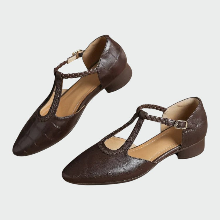 Vintage-style women's T-Bar Mary Jane shoes with a sleek pointed toe and comfortable low block heel. Classic design.