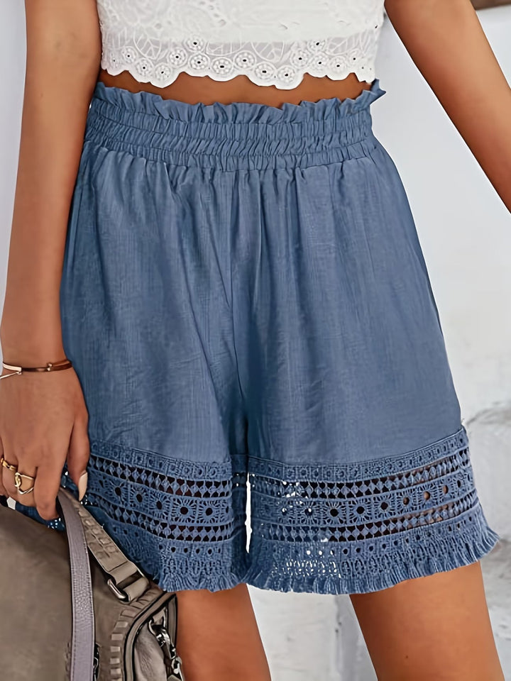 Feminine women's casual shorts featuring elegant lace details & functional slant pockets, ideal for warm weather comfort.
