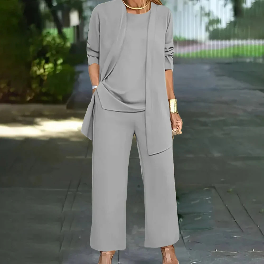 Versatile women's three-piece tailored pantsuit. Chic blazer, vest & trousers for professional office attire.