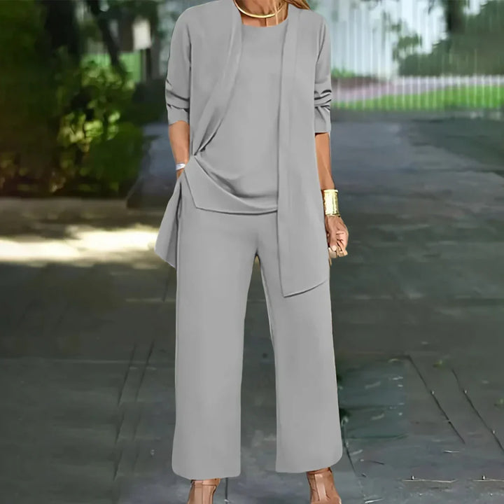 Versatile women's three-piece tailored pantsuit. Chic blazer, vest & trousers for professional office attire.