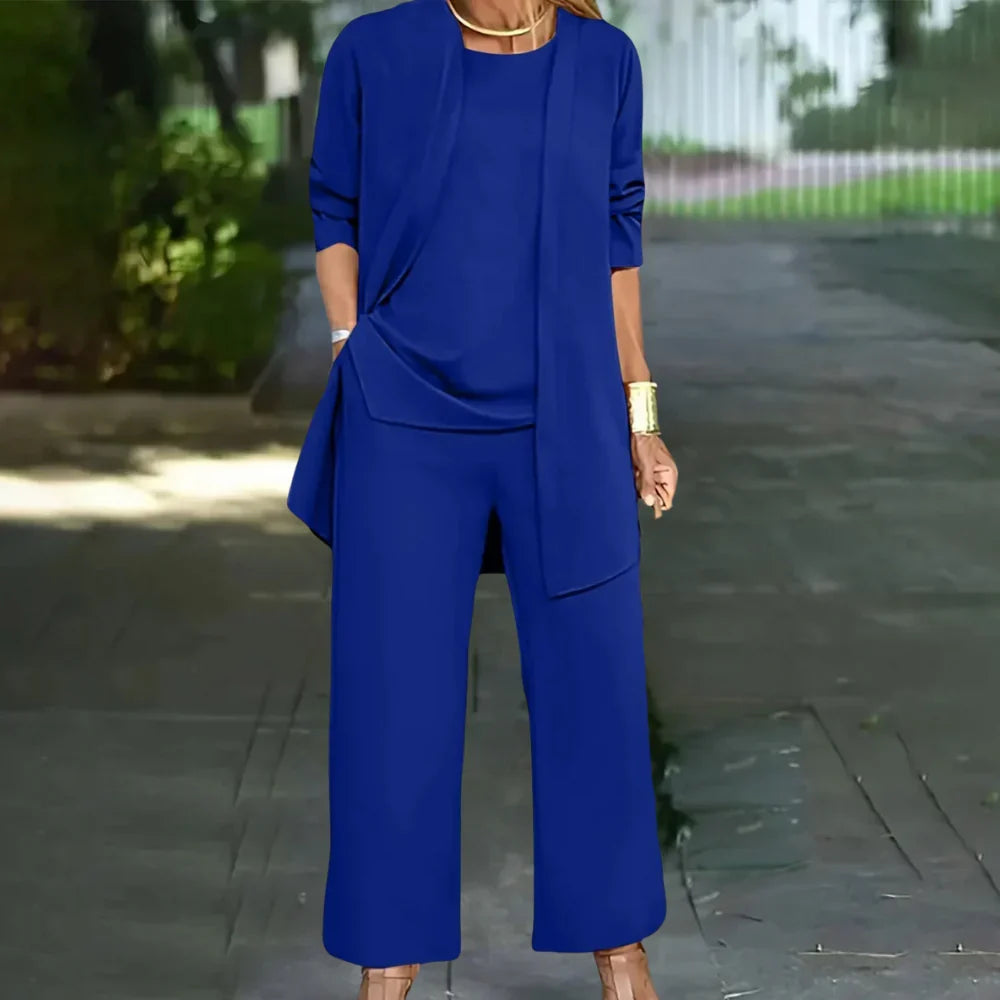 Modern women's business three-piece suit. Elegant tailored blazer, vest, and pants for a professional, chic office look.