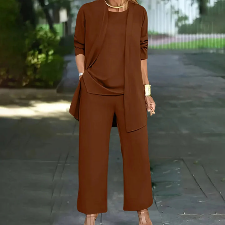Professional women's three-piece fashion ensemble. Elegant tailored blazer, vest & pants for business and formal settings.