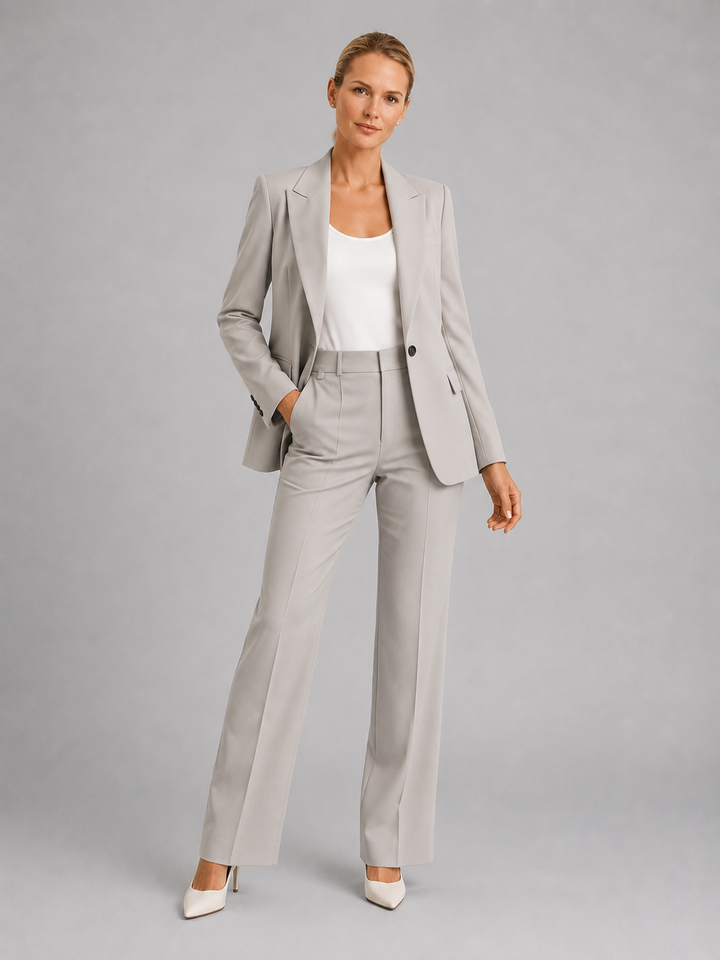 Close-up of an elegant women's tailored blazer, part of a sophisticated trouser suit for weddings & formal occasions.
