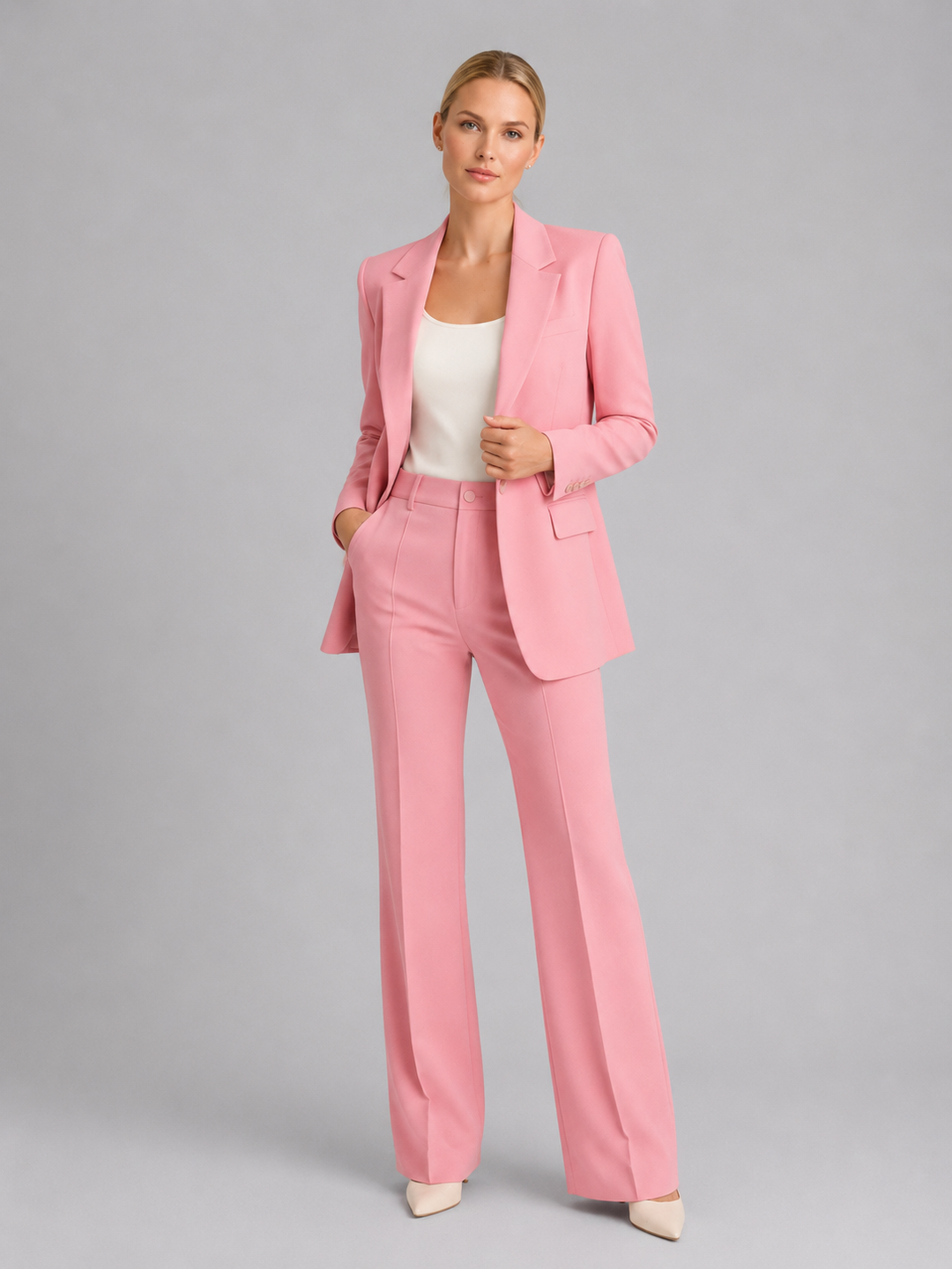 Full shot of a stylish women's tailored trouser suit, an elegant two-piece set for weddings and sophisticated occasions.