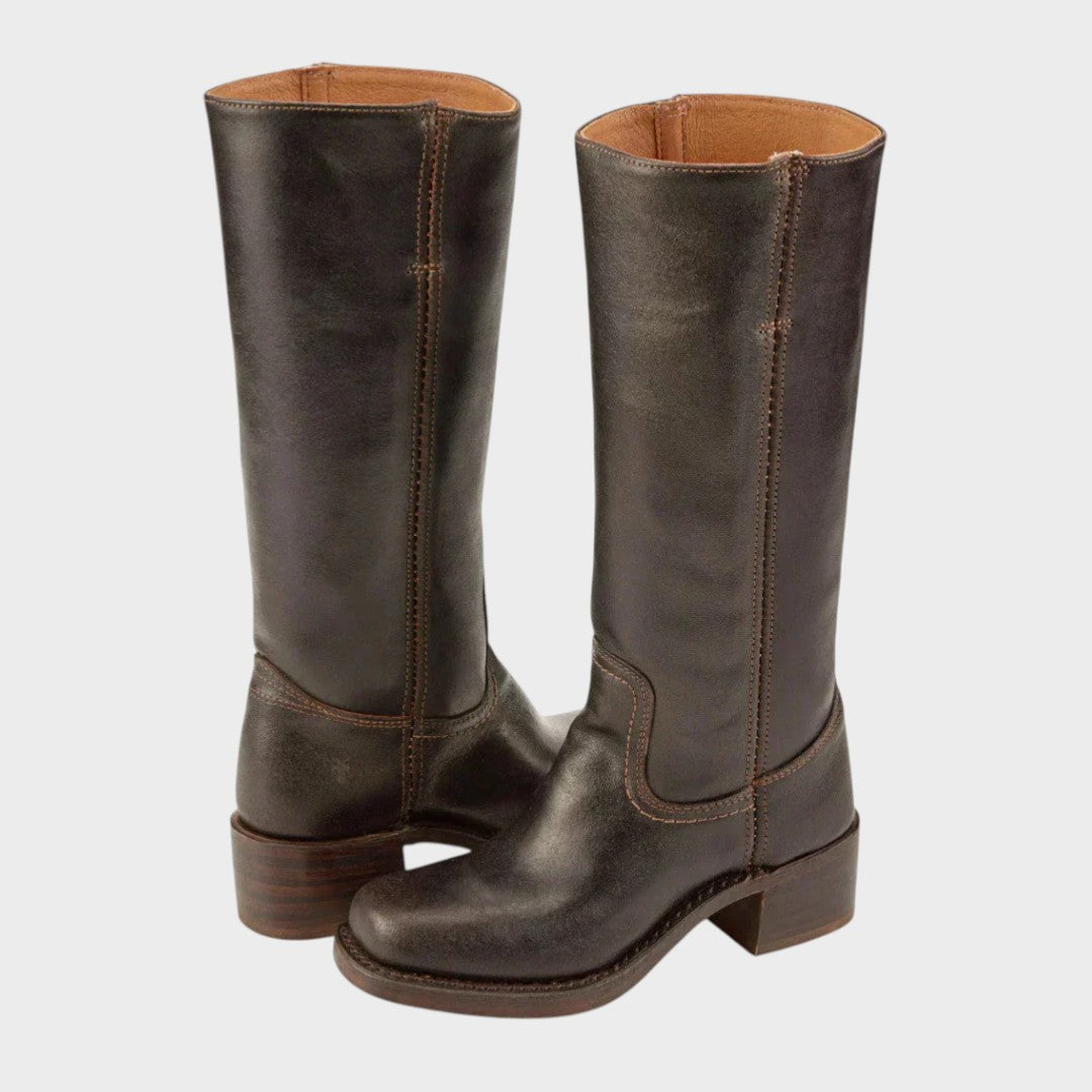 Elegant women's tall boots in black leather, perfect for fall and winter fashion. Stylish knee-high design.