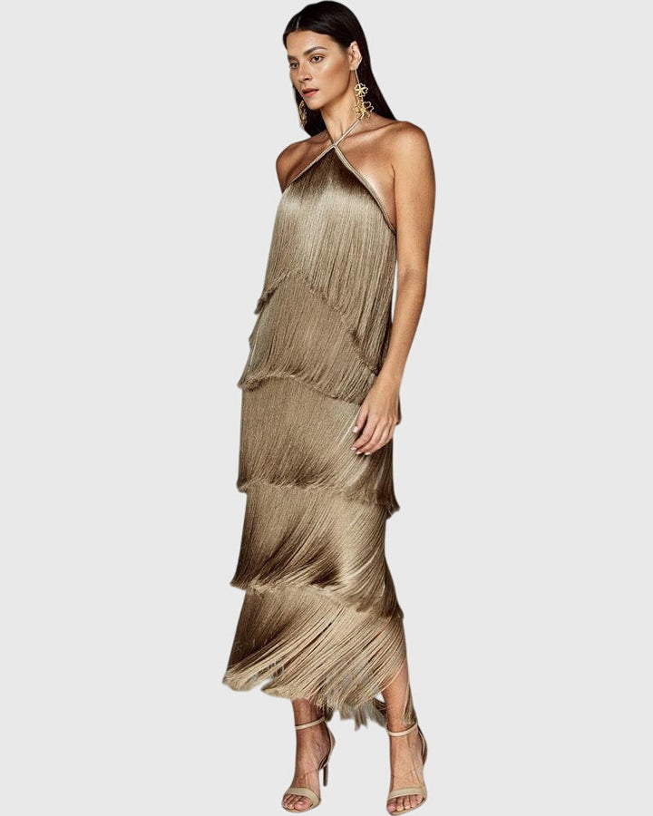 Detail shot: Delicate tassels on an elegant women's halter dress. Special occasion fashion.