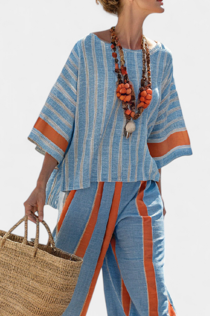 Stylish women's terracotta striped top & trousers set, a sophisticated and comfortable two-piece for travel or summer fashion.