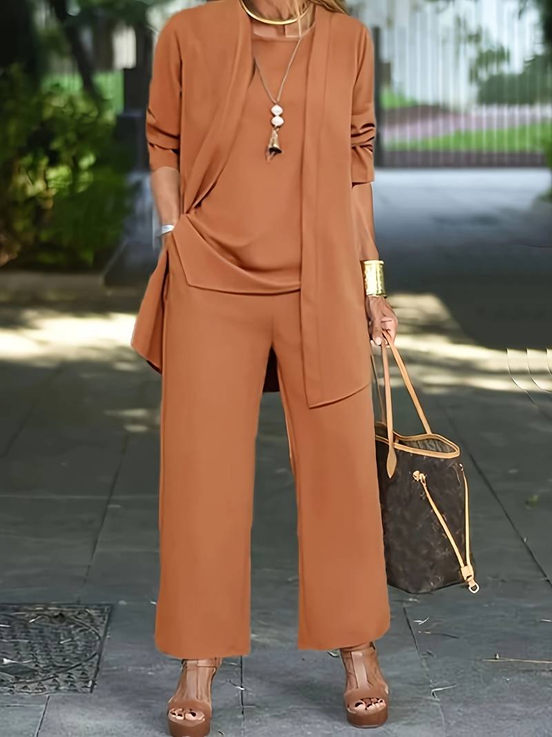 Sophisticated women's three-piece set: elegant long sleeve top, tailored trousers & chic jacket. Ideal for business & fashion.