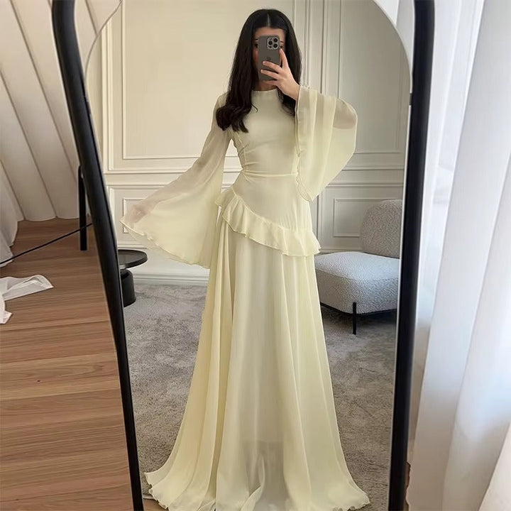 Graceful women's tiered maxi dress with bell sleeves, an elegant choice for any special occasion.