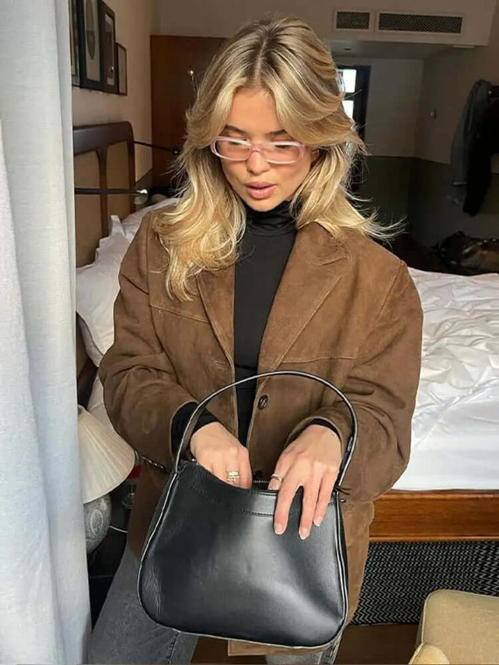 Versatile women's brown jacket. Chic fashion essential for elegant outerwear & timeless everyday style. A sophisticated layering piece.
