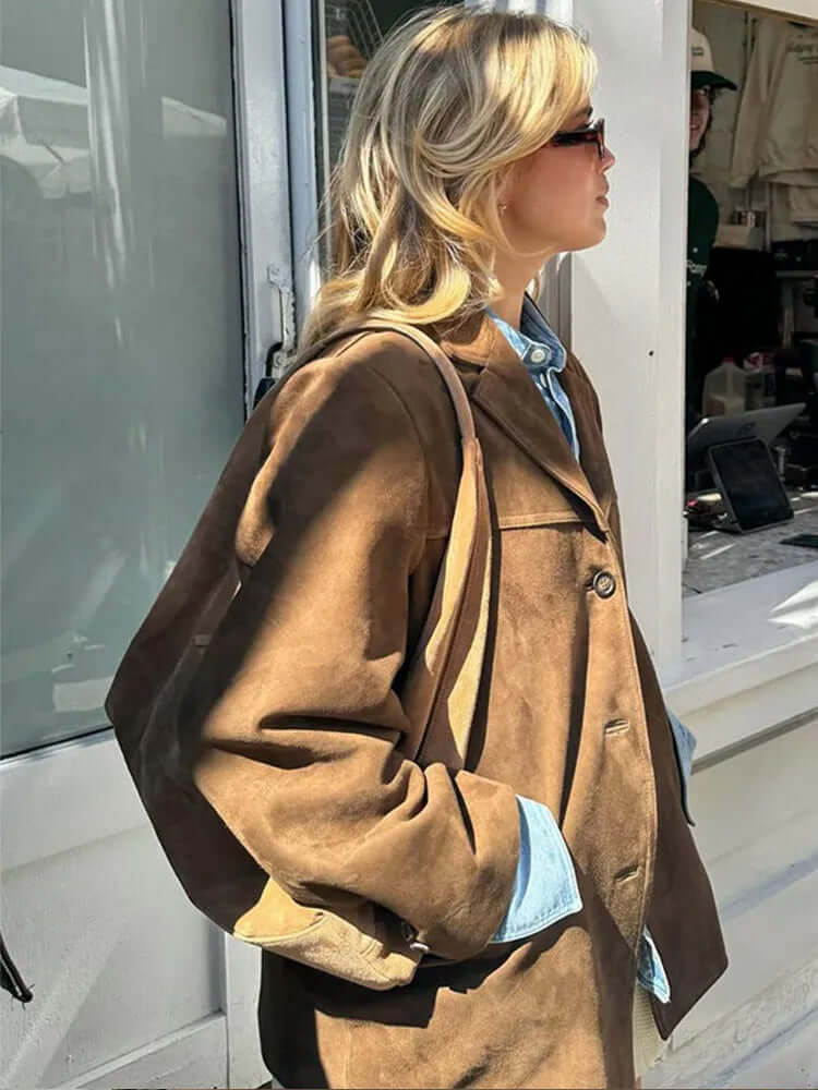 Stylish women's elegant brown jacket. Timeless apparel for a chic, sophisticated look. Versatile classic style outerwear.