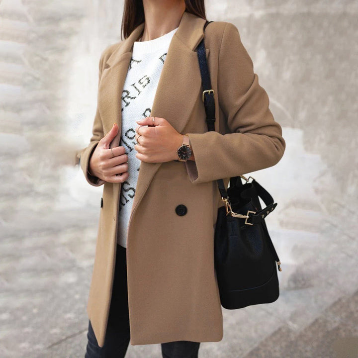 Sophisticated women's long winter coat in classic single-breasted design, ideal for elegant women's fashion.