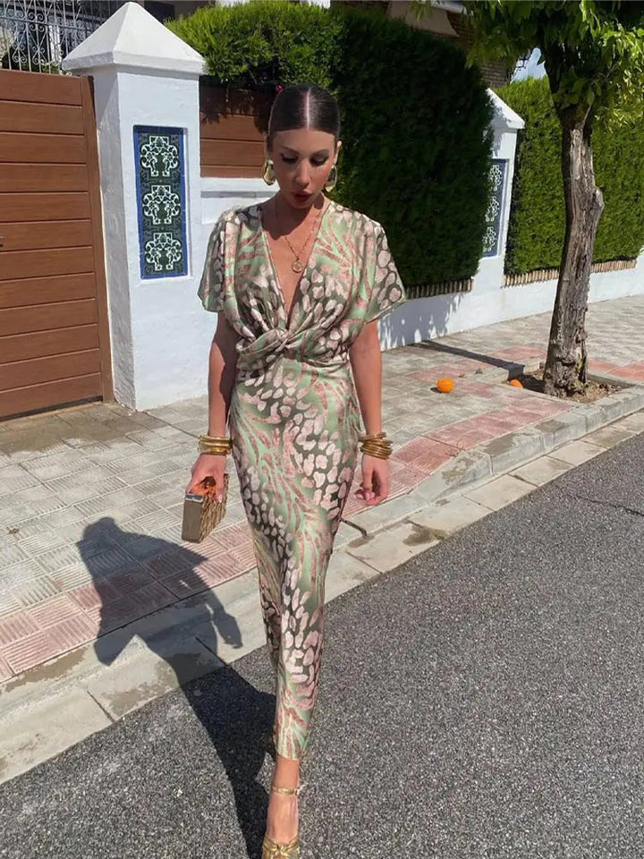 Chic women's printed midi dress with elegant kimono sleeves and a twist-front, ideal for summer parties.