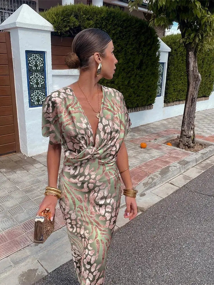 Elegant women's twist-front v-neck midi dress featuring flowy kimono sleeves and a vibrant print, ideal for weddings.